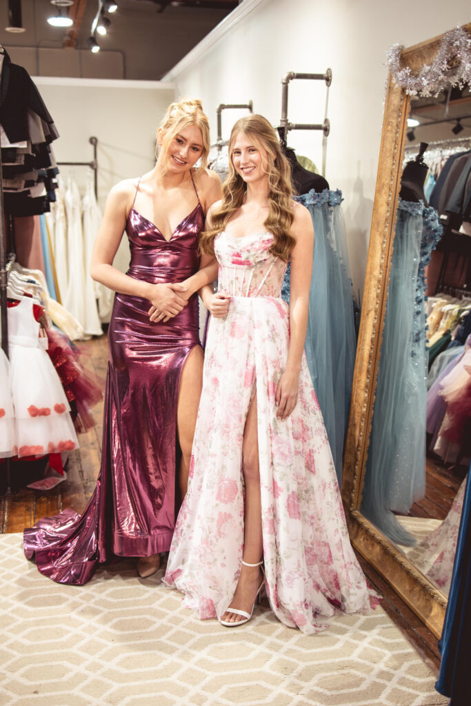 Pink metallic sleek prom dress and floral A-line gown with ruched corset top for a modern and romantic look. prom dress accessories