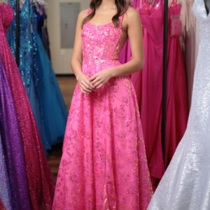 Shimmer with elegance in this pink A-line prom dress, featuring a delicate floral sequin pattern for a dreamy, romantic touch. Pink A-line prom dress with floral sequin pattern for a romantic and sparkling look.