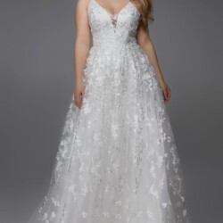 Lace A-Line v-neck Bride in lace wedding dresses Omaha NE boutique with intricate lace detail on bodice and sleeves