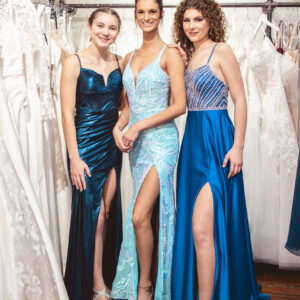 Shine in shades of blue! Choose from a ruched metallic fitted dress, a shimmering mint sequin gown, or a royal satin dress with a rhinestone-embellished top. Three blue prom dresses: ruched fitted metallic, mint sequin, and royal satin with rhinestone top, all featuring spaghetti straps. coordinating prom dresses and tuxedos. affordable formal wear
