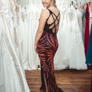 Set the night on fire in this bold black flame sequin prom dress, featuring a daring crisscross back for the ultimate statement look. Black flame sequin prom dress with a sassy crisscross back for a bold and edgy look.